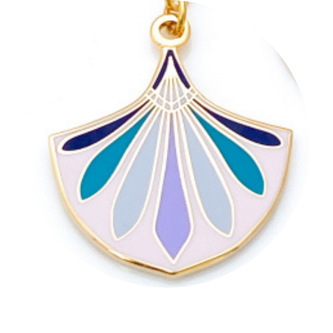 Decorative pendant with blue and purple design on a white background