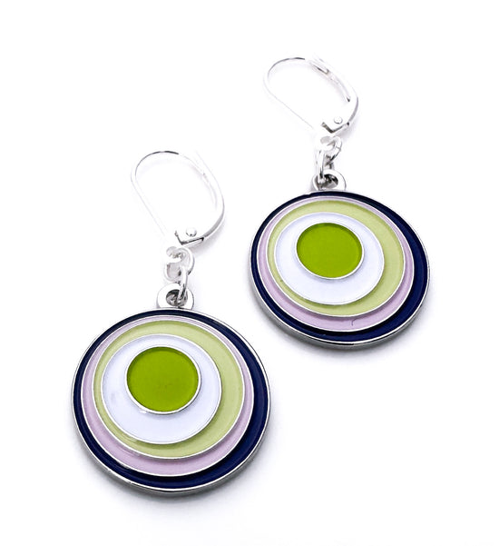 Pair of circular earrings with green, white, and purple concentric circles on a white background.