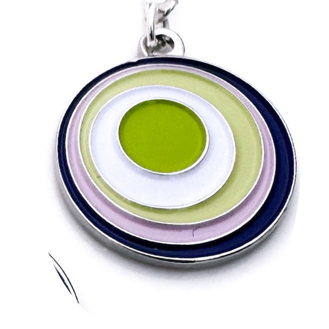 Multicolored circular pendant on a white background