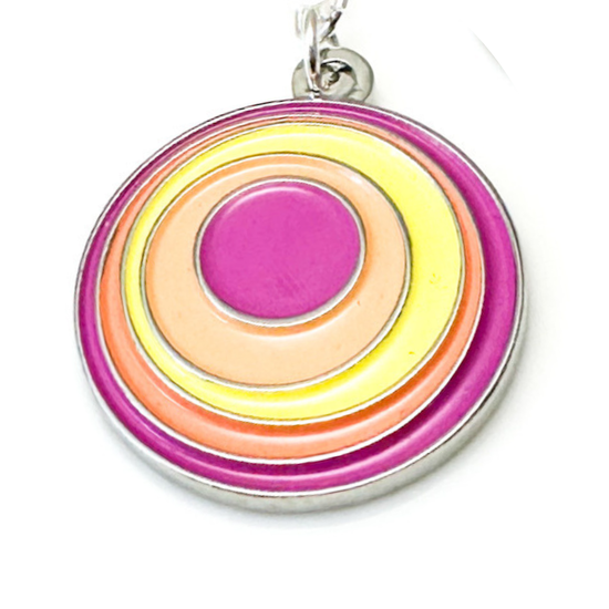 Colorful circular pendant with a pink center on a white background