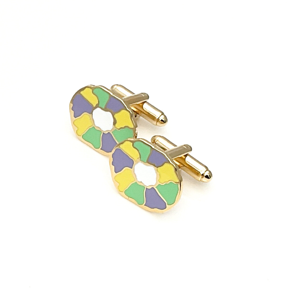 Colorful tie clip with gold accents on a white background