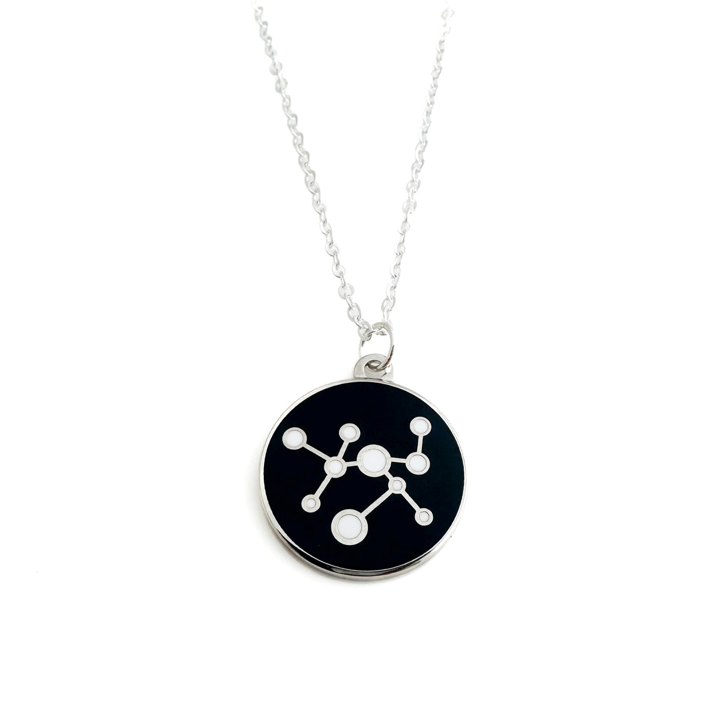 Necklace with a black pendant featuring a white molecular structure design For MIT museum