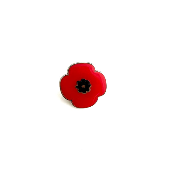 Red poppy flower pin for Remembrance Day – commemorative jewelry symbolizing military sacrifice and honoring veterans