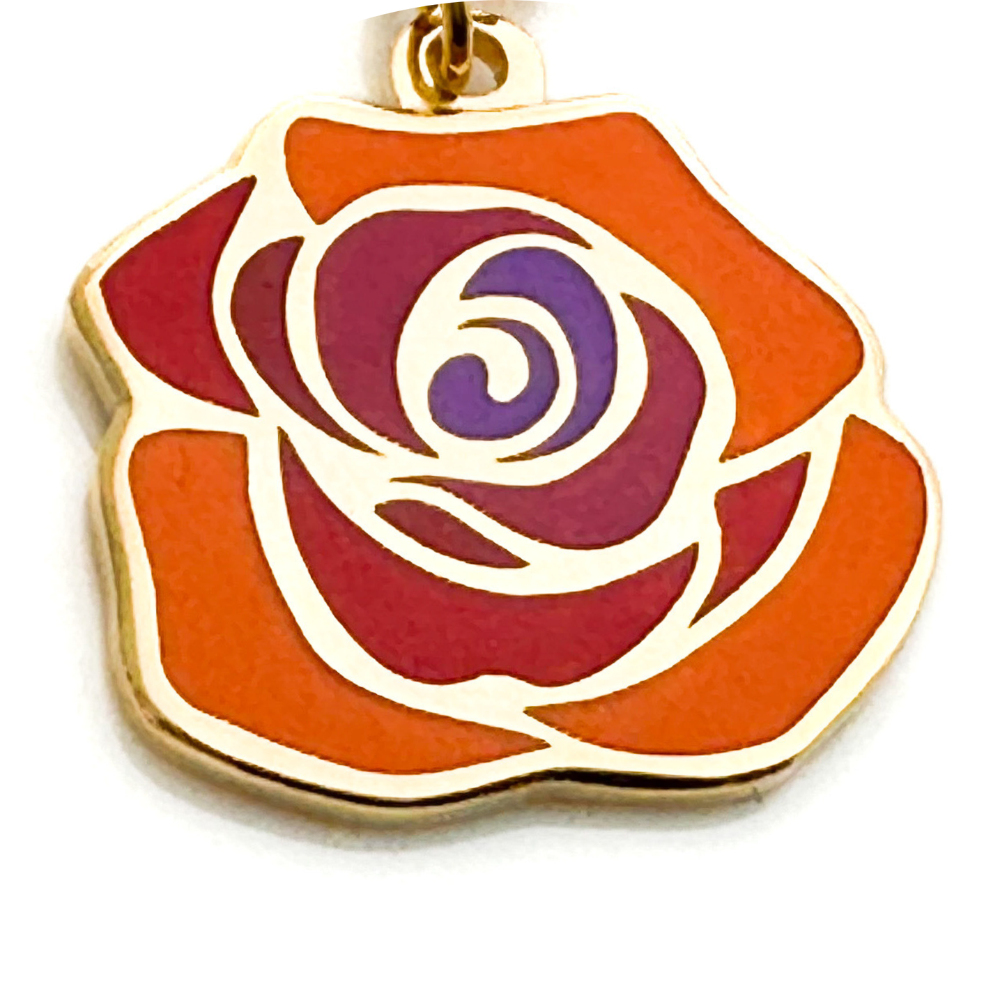 Rose-shaped pendant with gold outline on a white background