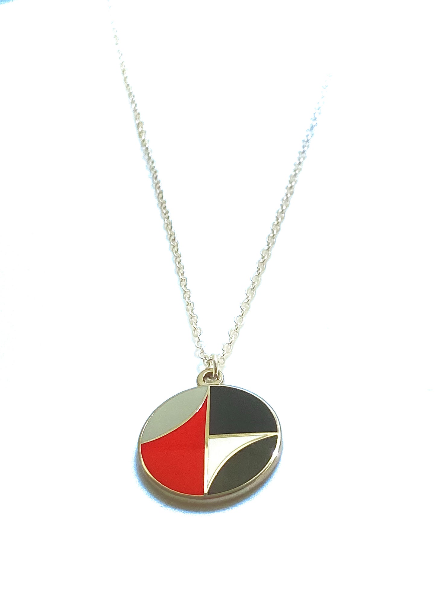 Necklace with a geometric pendant on a white background