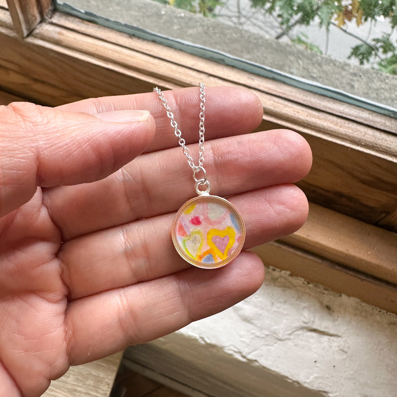 necklace made with kids or people art