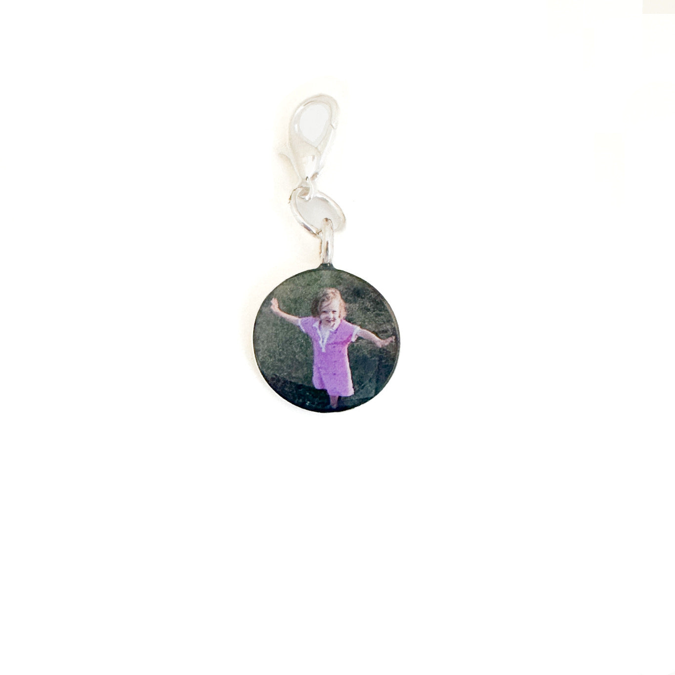 Personalized photo charm to keep loved ones close. Add a special photo for a timeless, meaningful piece of jewelry.