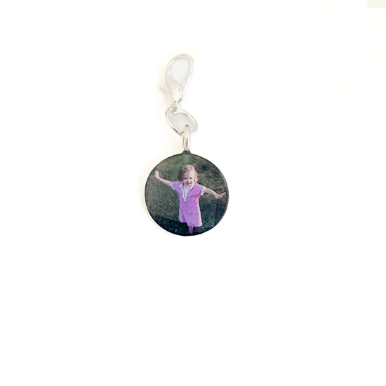 Personalized photo charm to keep loved ones close. Add a special photo for a timeless, meaningful piece of jewelry.