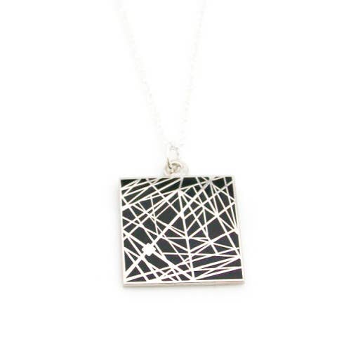 Black enamel necklace with pattern of interesecting lines