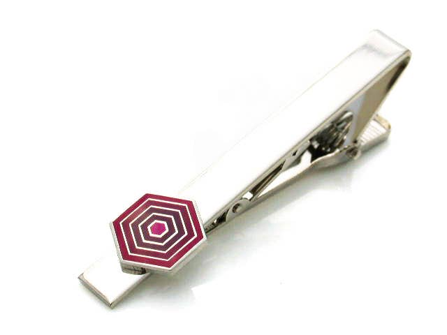 Honey comb shaped pink enamel piece on a tie clip