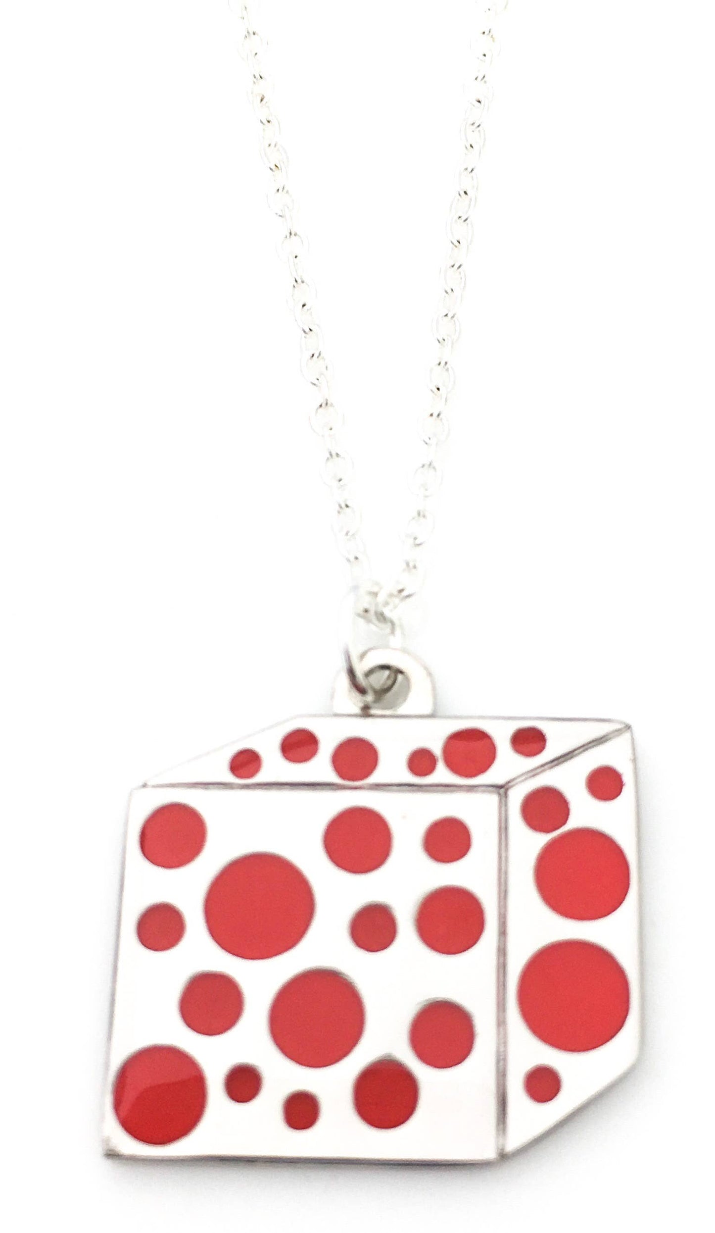 Cube shaped necklace with red enamel polka dots