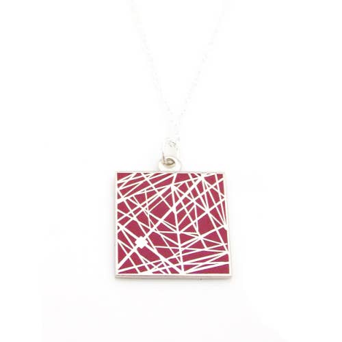 Red enamel necklace with pattern of interesecting lines
