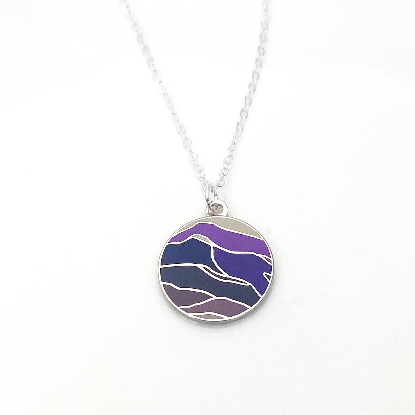 Round necklace with a waves of purple enamel
