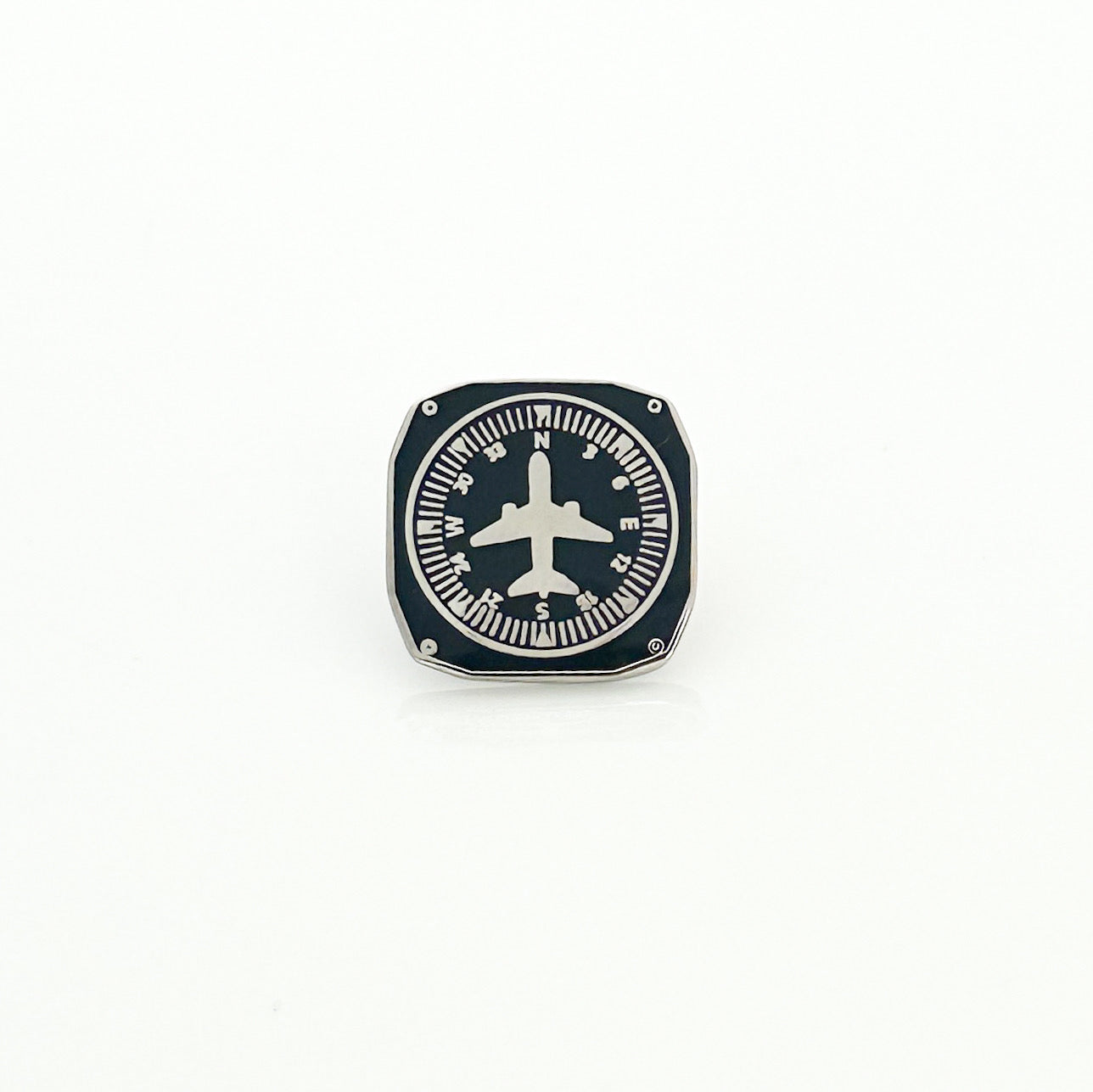 Flight Heading Indicator Pin featuring a detailed design inspired by aviation heading indicators, expertly crafted to celebrate the art of flying, making it a stylish accessory for aviation lovers.
