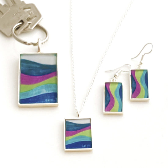 Set-of-matching-artwork-keychain-earrings-and-necklace